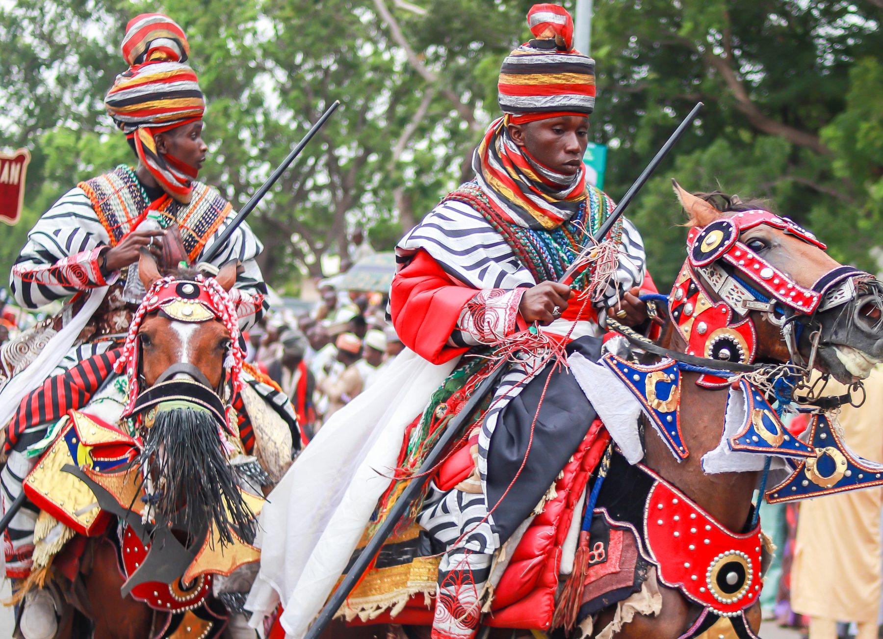 Colorfully adorned Durbar festival horsemen in traditional regalia
