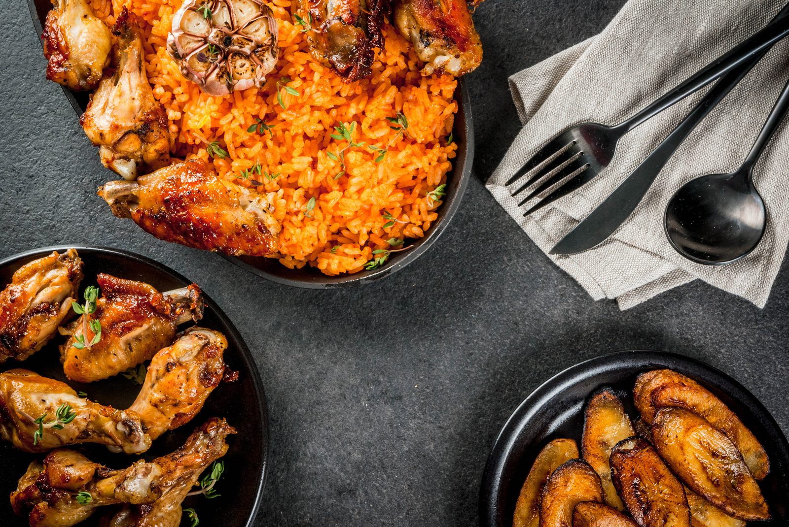 Jollof rice, grilled chicken and fried plantain spread