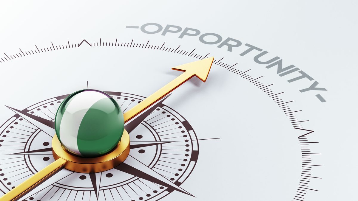 Compass pointing toward opportunity, with a Nigerian flag-colored needle